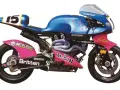 La moto de carreras Britten V1000, azul y rosa, con el número 15, lista para la pista.