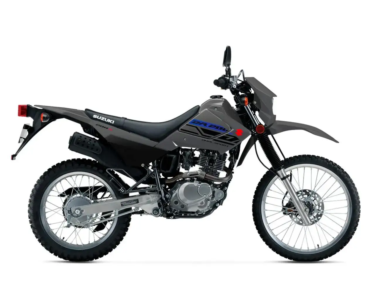 Suzuki DR 200S, una motocicleta dual sport gris lista para la aventura.